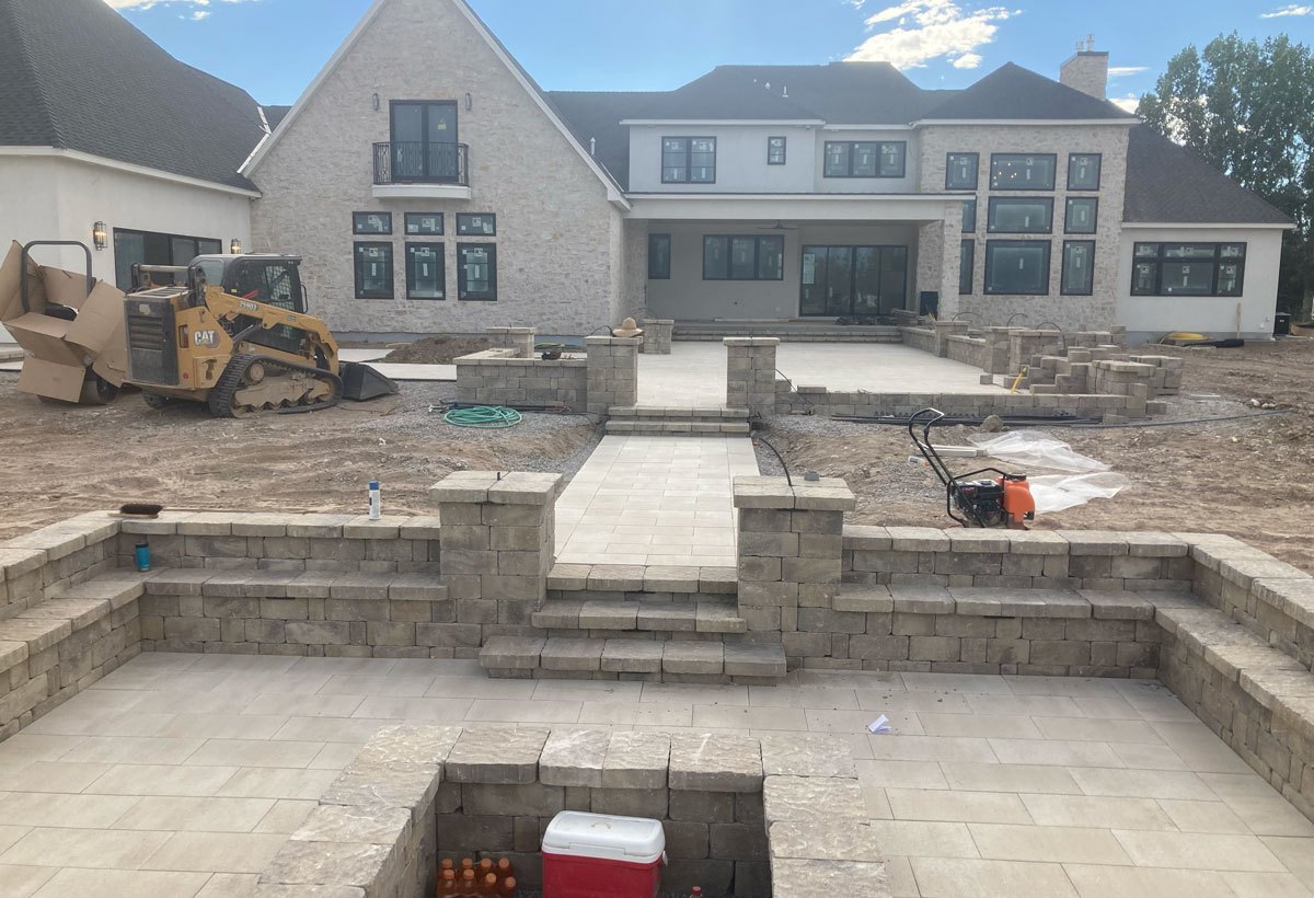 Hardscape and patio base under construction by B&K