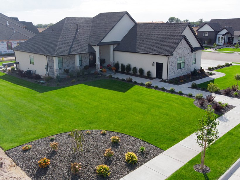 Aerial view of an estate lawn and landscape